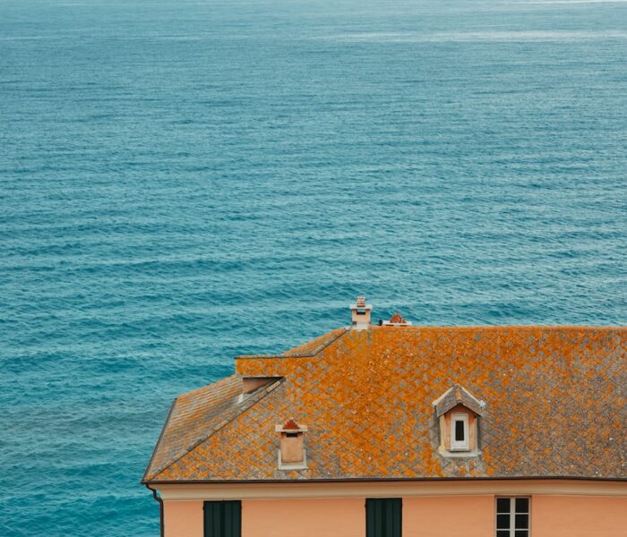 a view of the ocean from the roof of a building